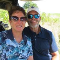 Man and woman in golf cart
